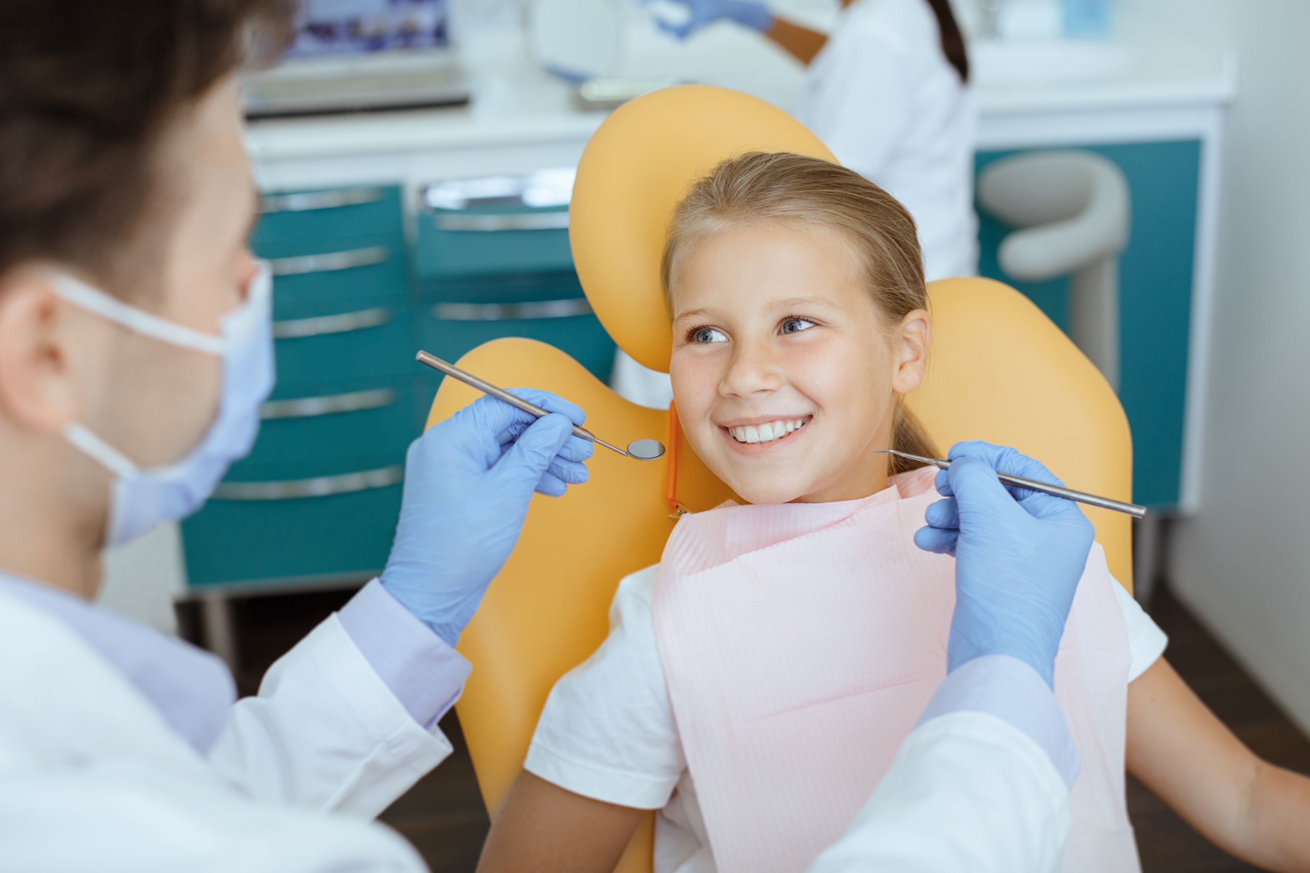 Child at dental checkup for sealant treatment