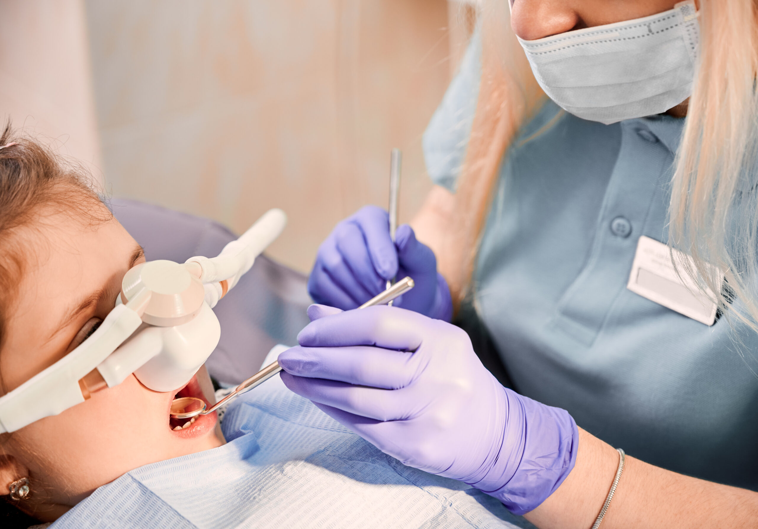 Dental team caring for a patient during a calm sedation dentistry visit